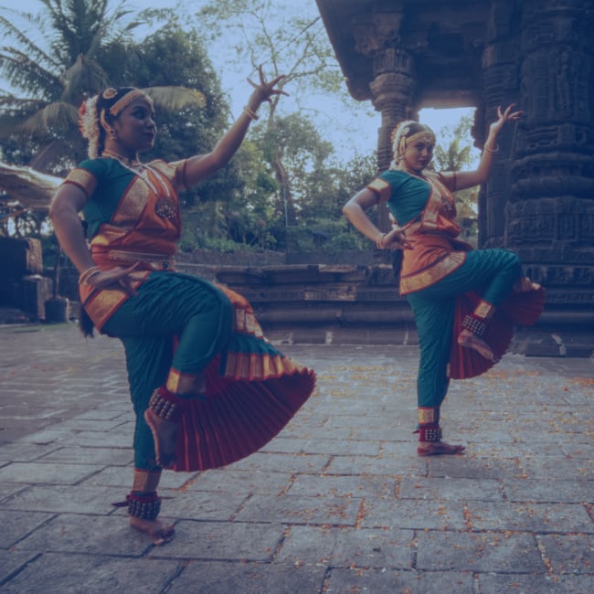3 indian dancers performing a dance routine