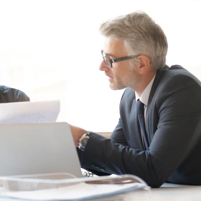 A financial advisor reviewing docs.